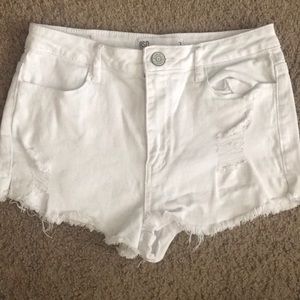 White ripped shorts